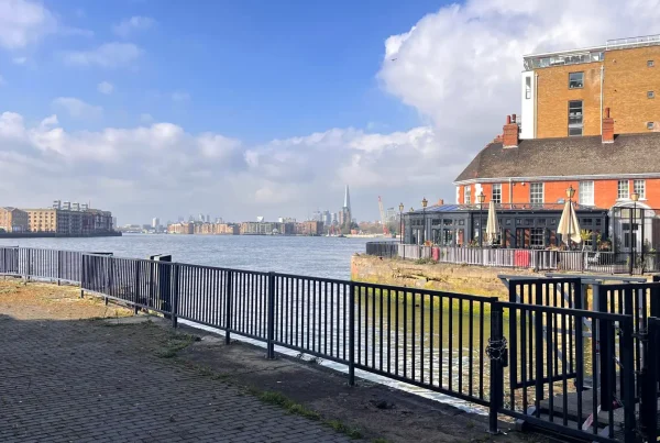 The entrance to Limehouse Marina looking back down the Thames with The Shard on the horizon